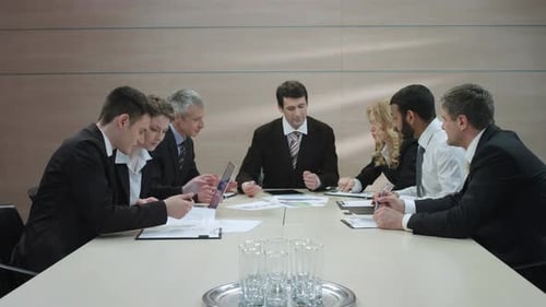 Group Discusses Business at Conference Table