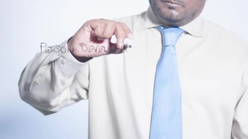 Asian Businessman Writes Personal Development