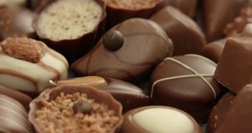 Delicious Assorted Chocolates Rotating in Close-Up