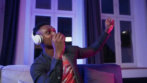 Man Enjoys Music, Dancing With Headphones On