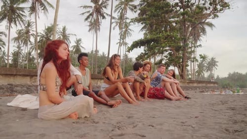 Group of Friends Sitting on Beach in Bali