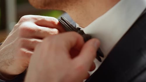 Unrecognizable Man Preparing for Wedding Outdoors. Gentleman Standing in Park.