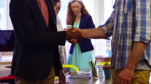 Men Handshake in Bright Modern Office Workplace