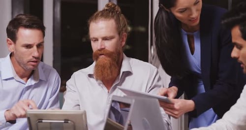 Diverse Team Collaborating on Project in Urban Office