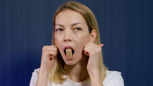 Woman Is Training Her Facial Muscles, Practicing Face Yoga, Portrait Indoors