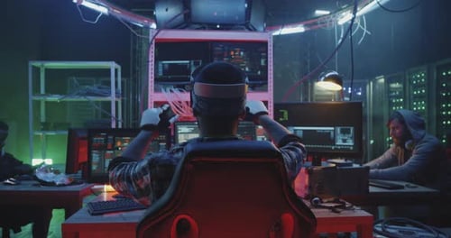 Hackers Working in Dark Server Room with VR