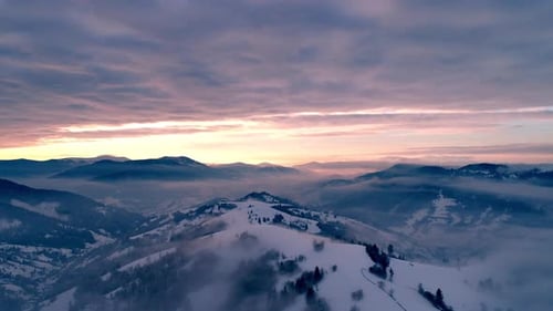 Aerial View in Foggy Sunset Winter Mountain