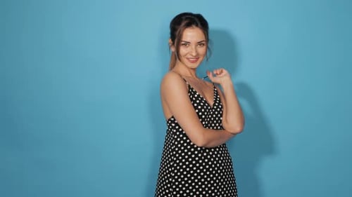 Young beautiful smiling woman looking at camera.Attractive girl posing in studio