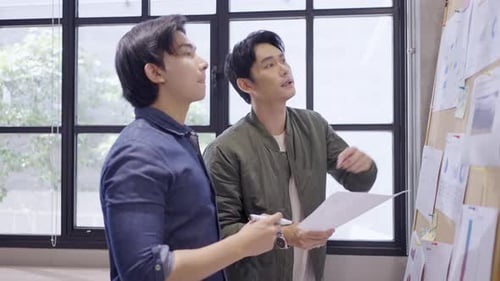 Young Adults Collaborate During an Office Meeting