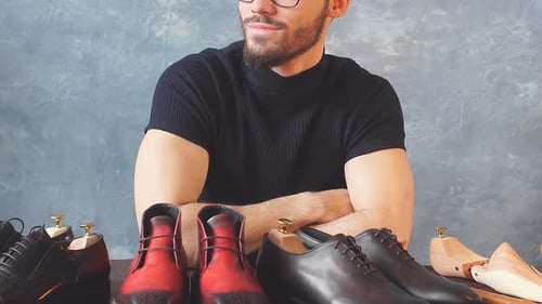 Stylish Man with Handmade Leather Shoes on Display