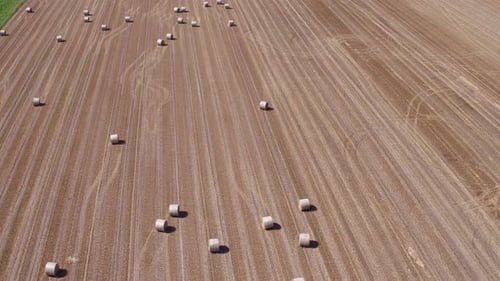 Aerial View of Stubble Field With Straw Bales