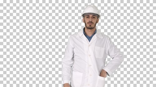Scientist engineer in safety glasses and hard hat walking