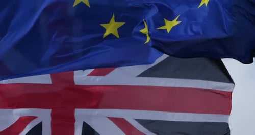 Flags of the UK and European Union Waving