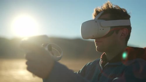 Young Adult Using VR Headset at the Beach