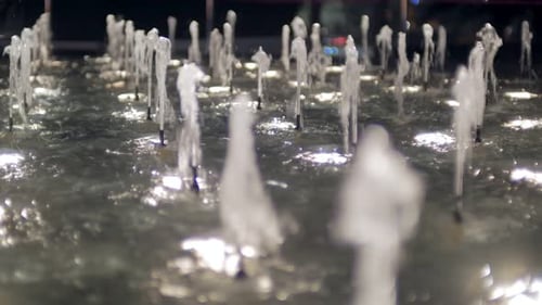 Streams of Clear Water in a Fountain with Illumination