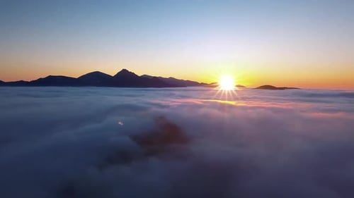 Sunrise Over a Sea of Clouds