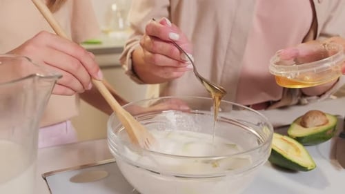 Two people cooking in the kitchen