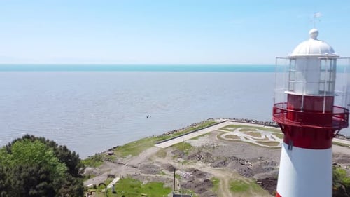 Lighthouse By The Sea