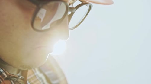 Builder with Blueprint at Building Site Close Up