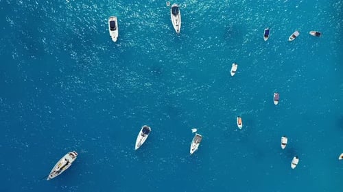 Yacht on the water surface from top view. Turquoise water background from top view. Summer seascape