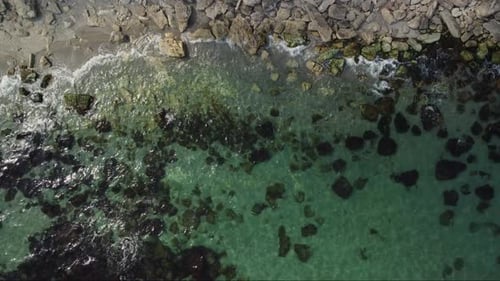 Aerial View of Rocky Beach and Sea Waves