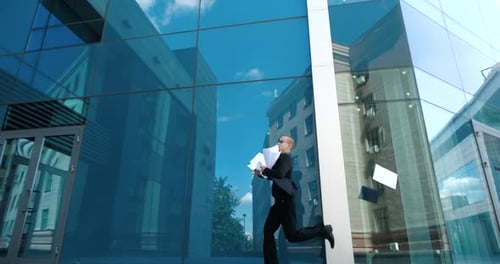 Male in Black Suit, Businessman, Employee Runs To Office for Meeting, Late in Morning for Work, Hold