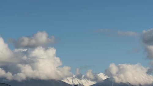 Majestic Mountains and Clouds on a Beautiful Day