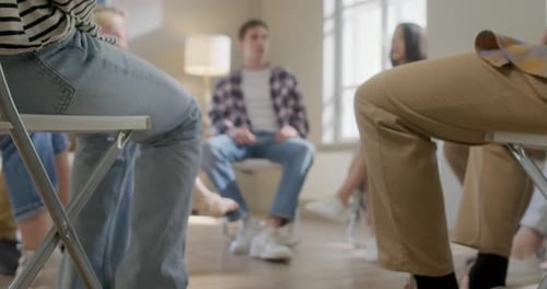 Group of Young Adults Sitting in Circle