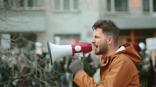 Man Walk and Hold Megaphone in Hand Shout Close Up, Human Rights Demonstration