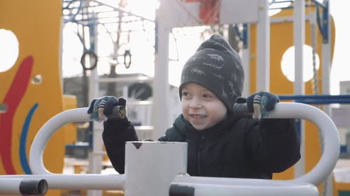 Kid Boy Playing in a Street Gym