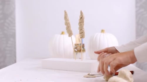 Step by step. Mother and daughter decorating Halloween craft pumpkin with unicorn theme.