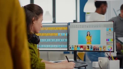 Woman Photo Editing at Computer in Modern Office