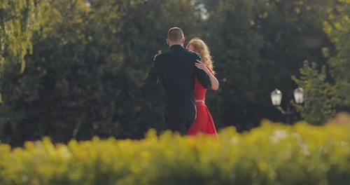 Couple Dancing Tango in Green Urban Park Setting