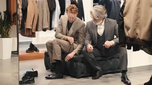 Male Customer Trying on Shoes at the Men's Wear Store