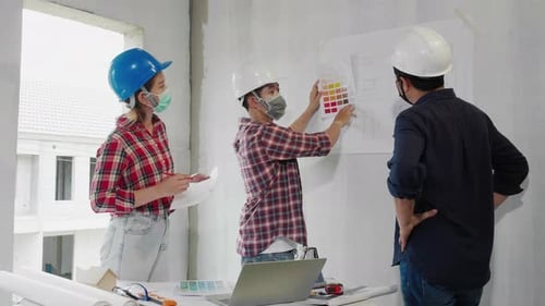 Real estate building construction engineer team discussing together.