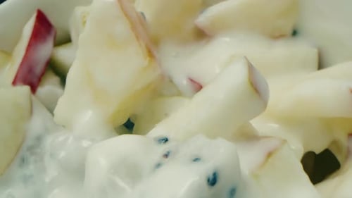 Close Up of Delicious Fruit Salad with Creamy Yogurt
