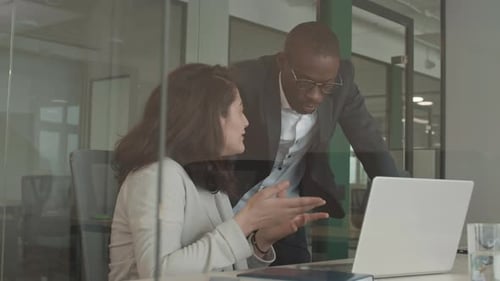 Professionals Discuss Project at Modern Office Computer