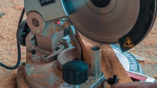 Carpenter Using Circular Saw for Cutting Wooden Boards