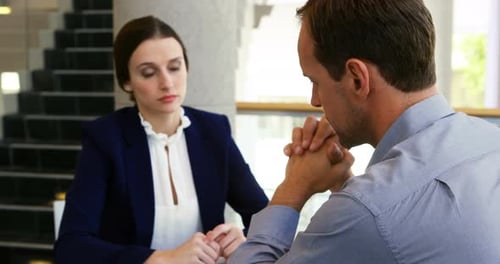 Executives discussing with each other in conference centre 4k