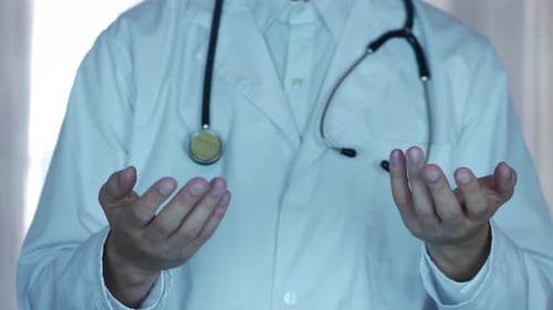 Doctor in White Coat gesturing with open hands