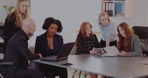 Professionals Collaborating at Meeting in Modern Workplace