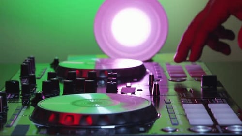 Dj Hands Playing Mix on Sound Board 12