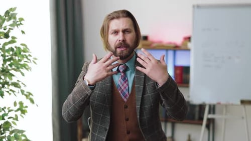 Business Man Explaining Something in Home Office