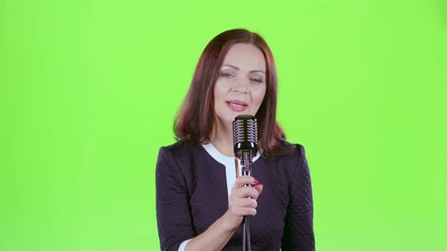 Woman Performs Her Song of Authorship. Green Screen