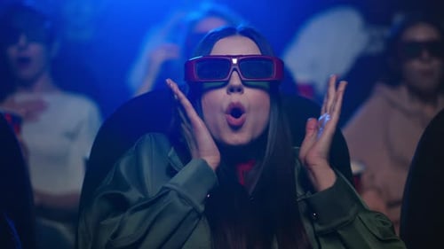 Frightened Woman Watching Horror in Cinema. Girl Feeling Scared in Movie Theater