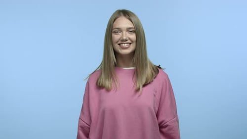 Smiling Woman Portrait on Blue Background