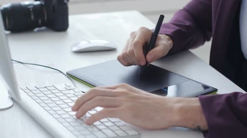 Close Up of Graphic Designer Working at Desk