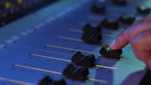 Audio engineer using sound mixer