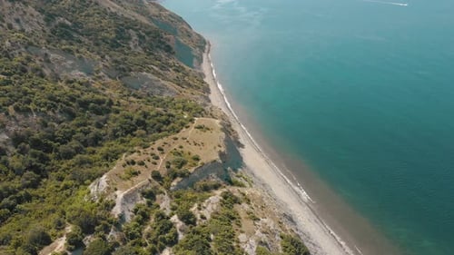 Aerial View of Beach, a Tropical Forest and Ocean with Waves. Azure Beach with Rocky Mountains and
