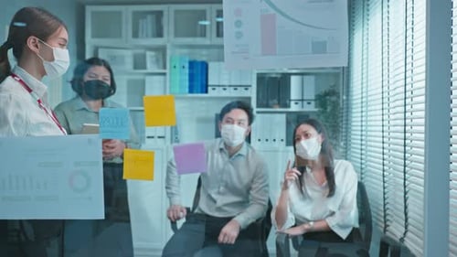 Group of Asian businessman and woman people wear mask, brainstorm and work meeting in office.